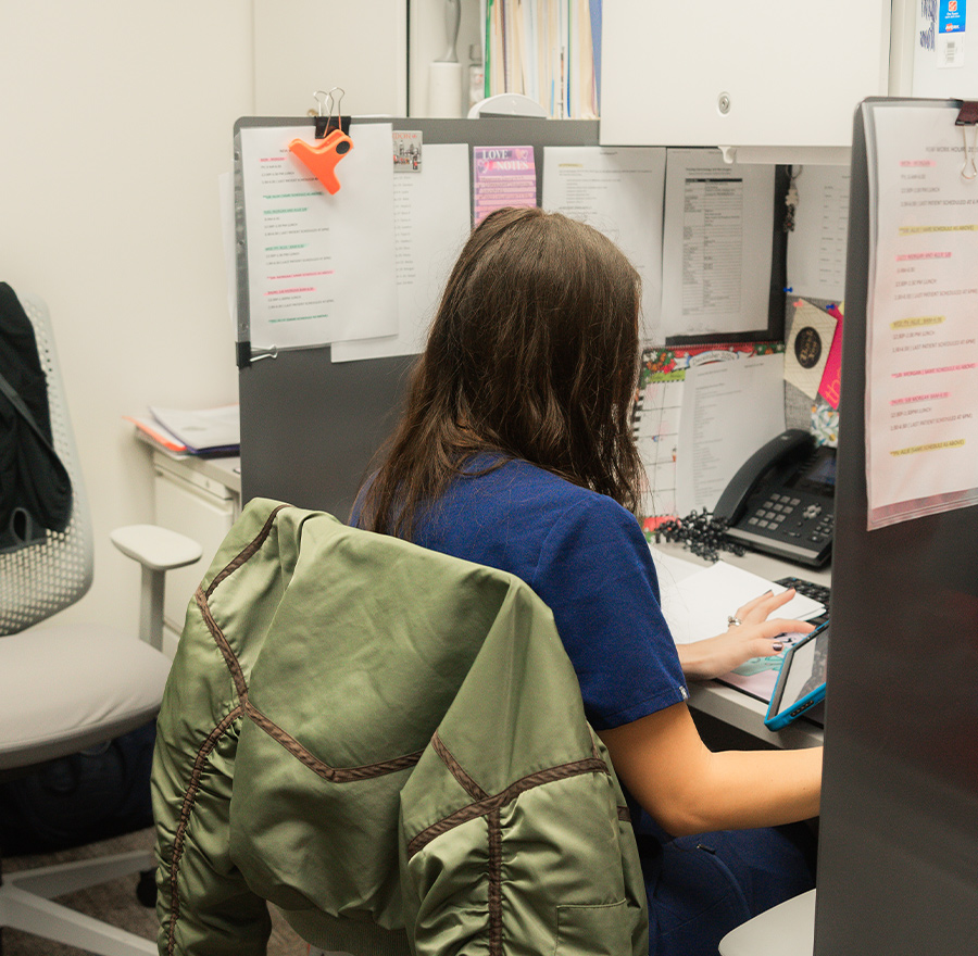 a person standing in front of a computer