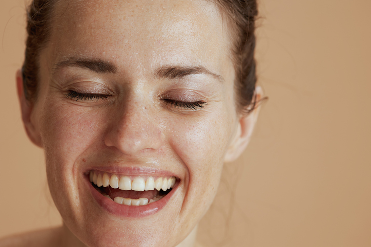 a close up of a person smiling for the camera